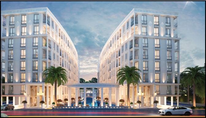 Modern building with curved sections, palm trees, and a welcoming entrance under a cloudy sky.